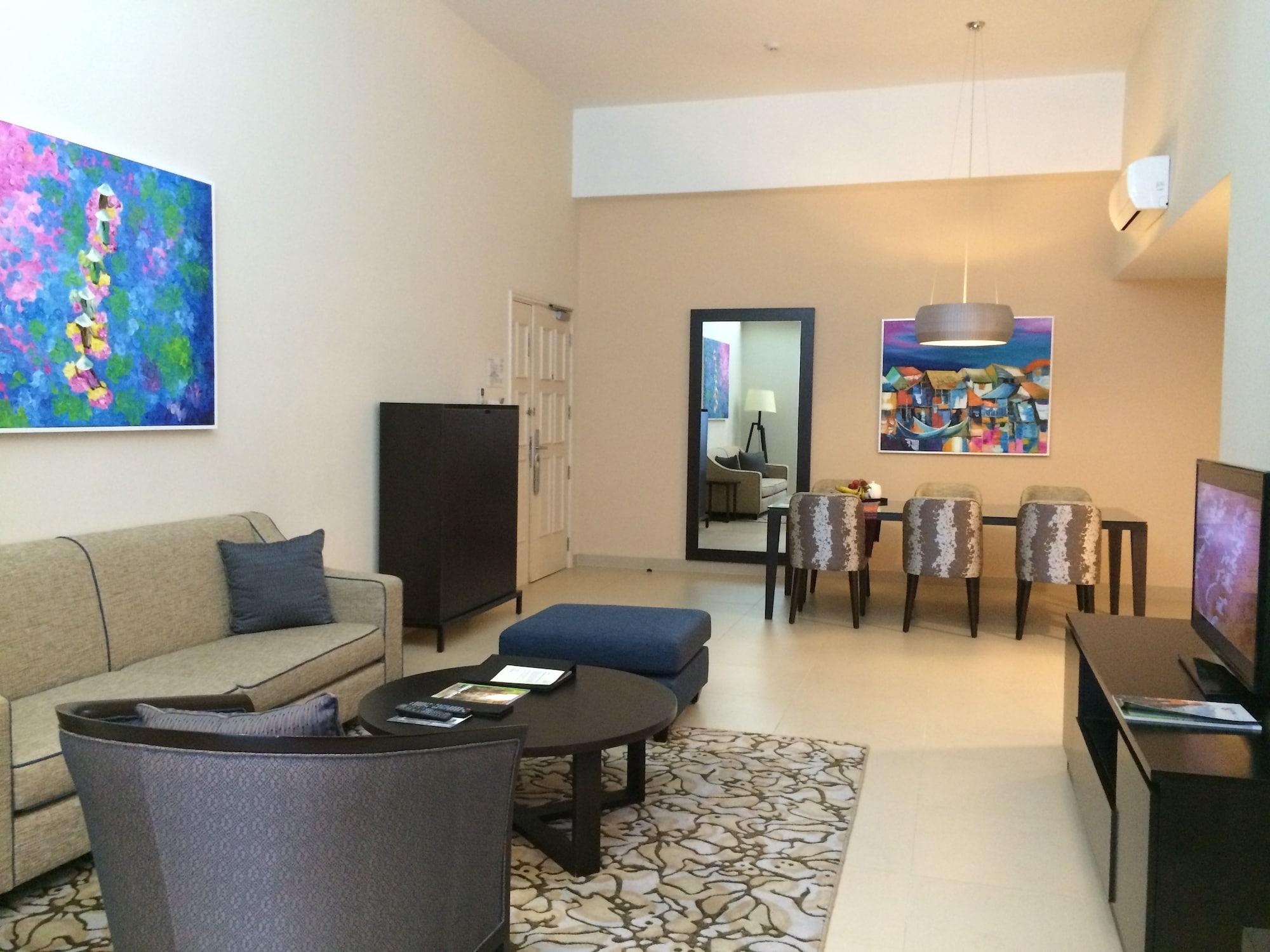 Somerset Hô Chi Minh-Ville Extérieur photo A living room in a typical apartment at the Ritz-Carlton, DIFC